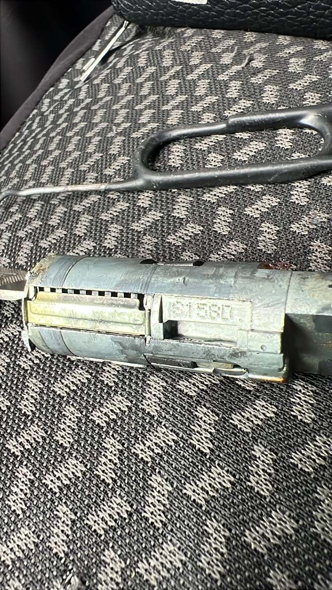 Automotive locksmith repairing a car ignition