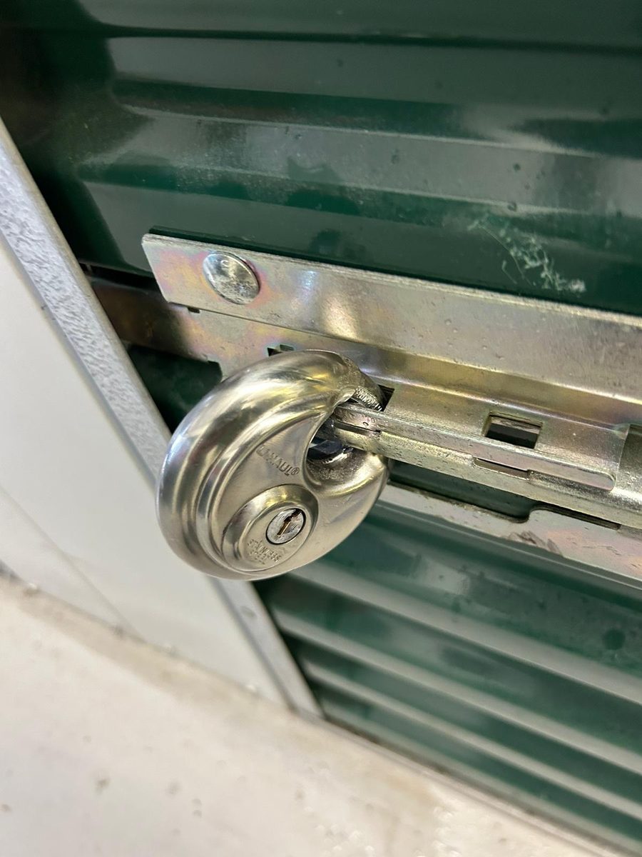 Locksmith opening a storage unit lock in Jacksonville