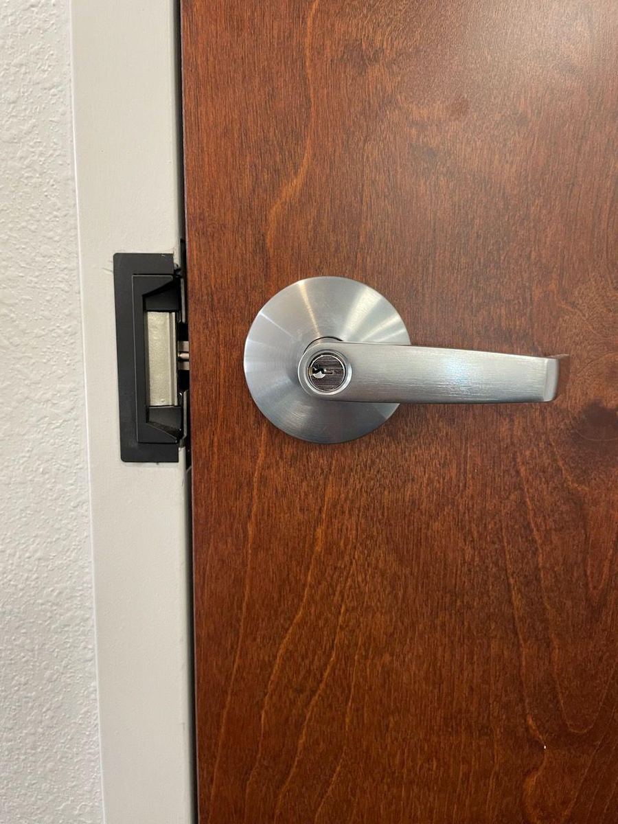 Jacksonville locksmith changing a door handle on a service call