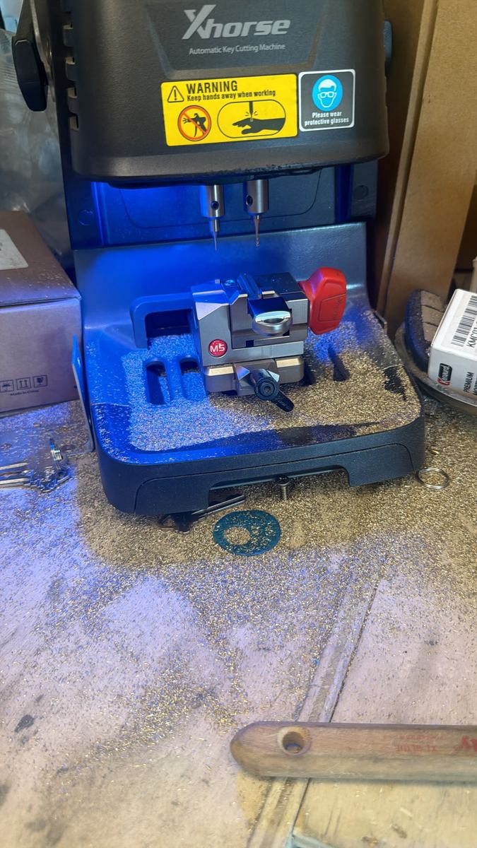 Key cutting machine in the 904 Locksmiths service van