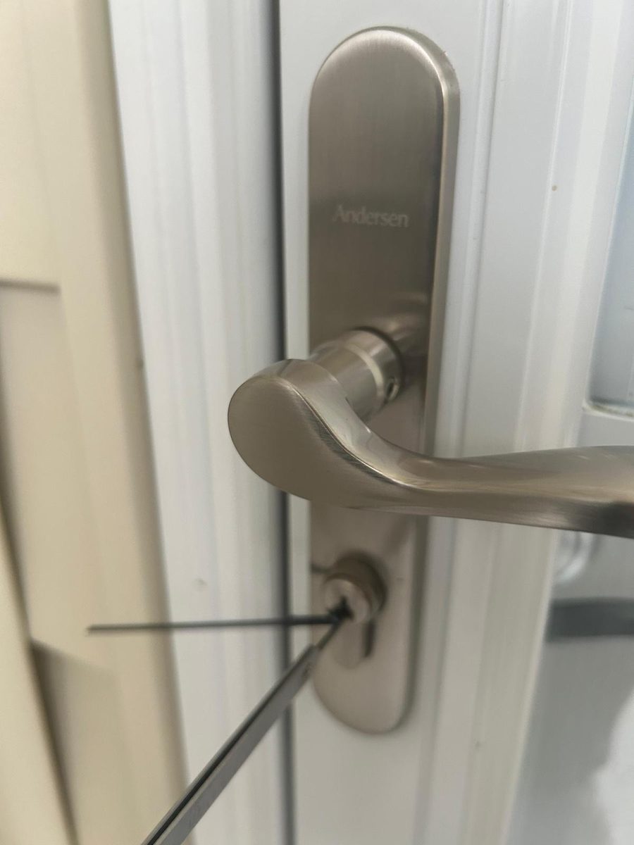 Locksmith unlocking a house door for a Jacksonville homeowner