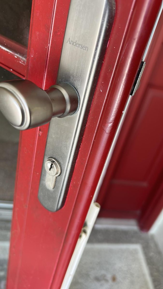 Replacing a storm door lock on a residential entry